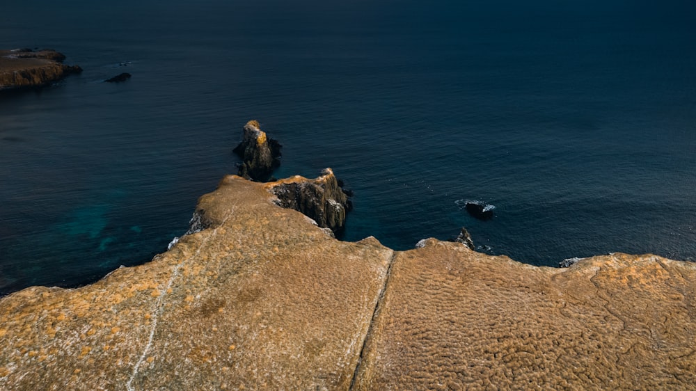 a rocky cliff overlooking the ocean