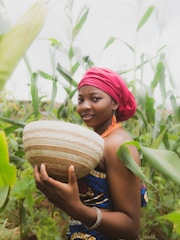 a person holding a coconut