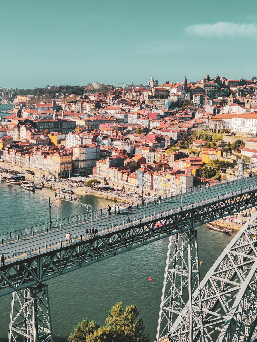 a bridge over a body of water with buildings on the side