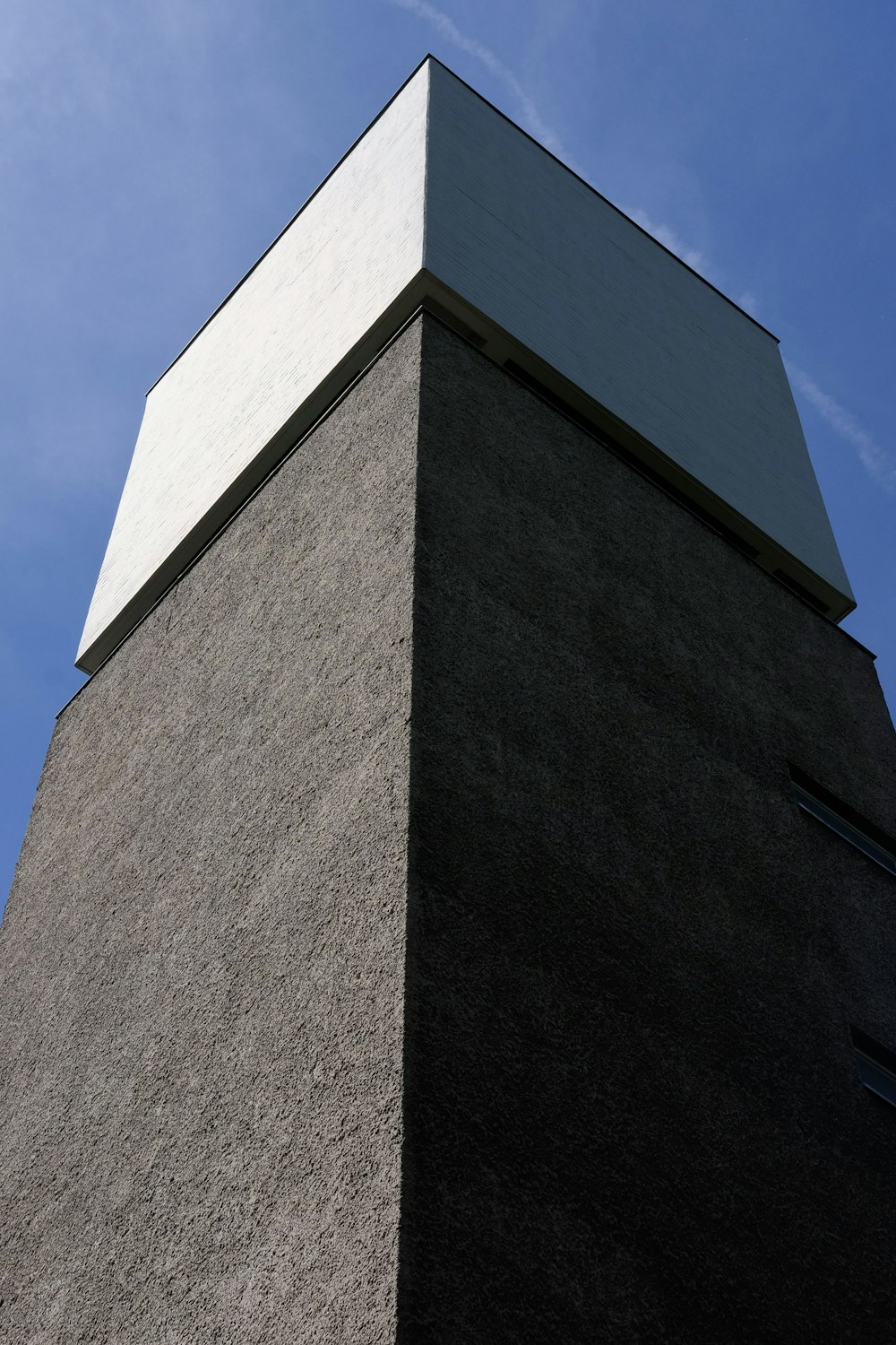 a tall building with a blue sky