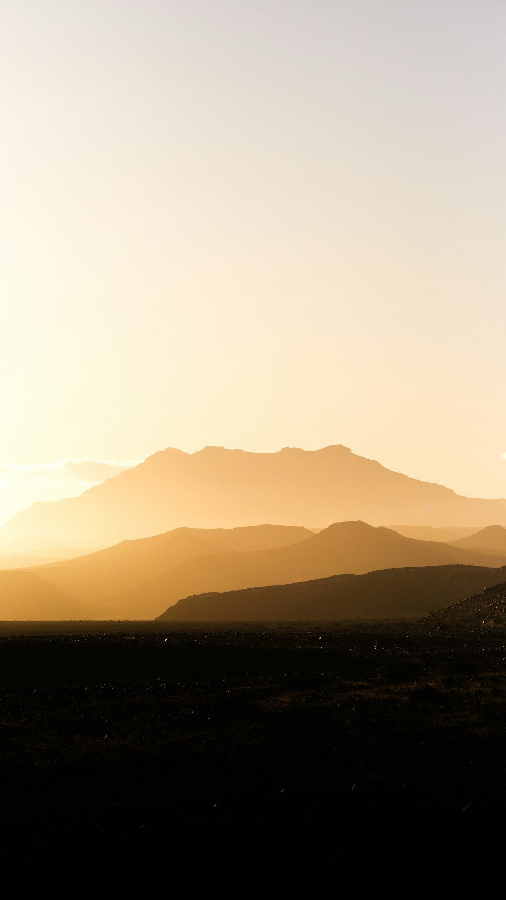 a landscape with hills in the back