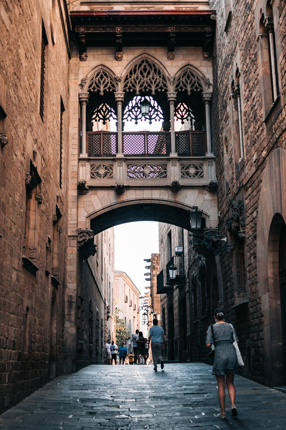 a group of people walking through an old building