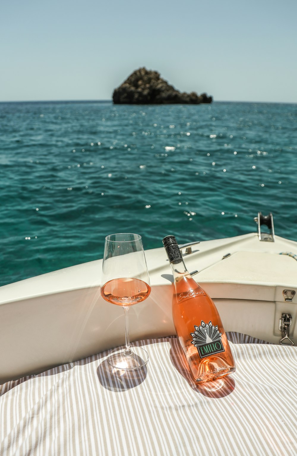 a glass of wine on a boat