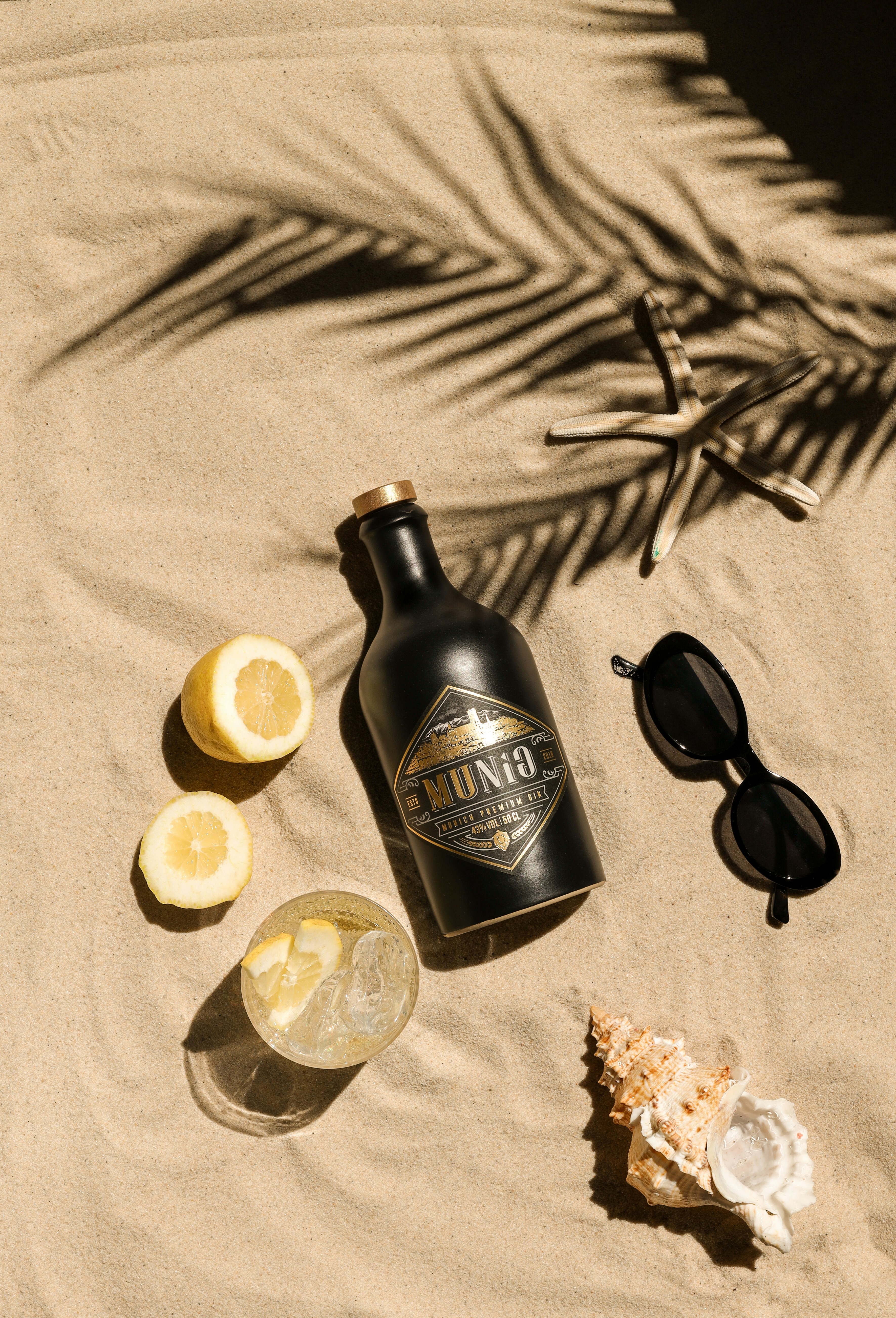 A bottle of alcohol and sunglasses on a blanket photo Free Spain