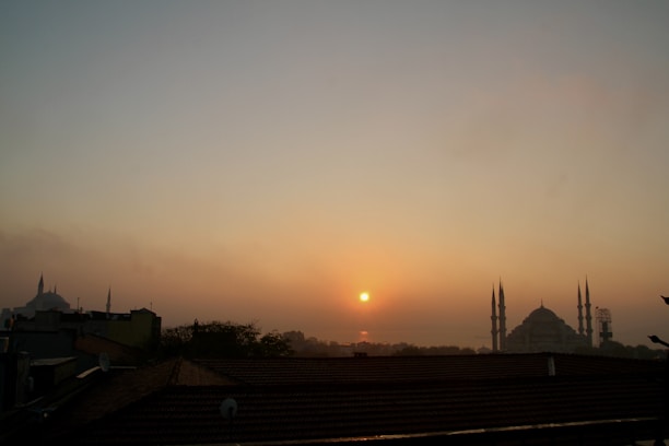 A serene sunrise over the Kaaba, capturing the peaceful start of a sacred journey.