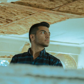 a man sitting in a tent