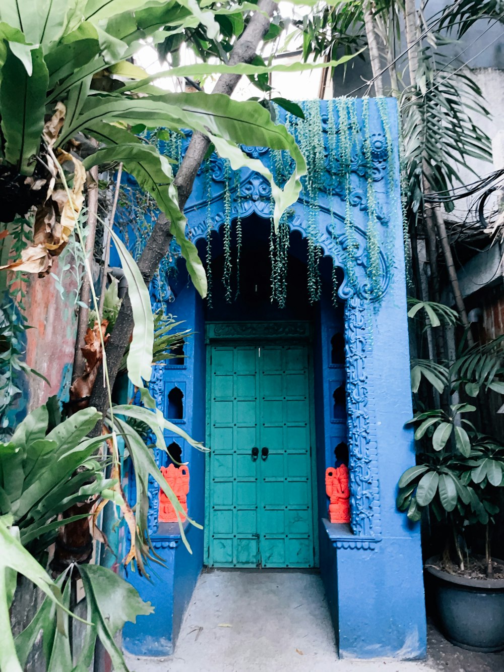 a blue door with a red bag