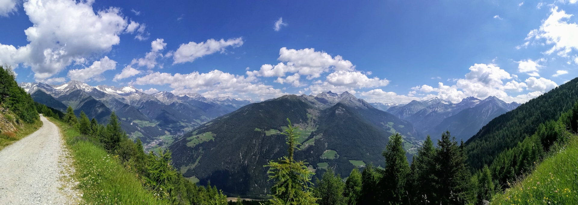 woman wearing yellow long-sleeved dress under white clouds and blue sky during daytime