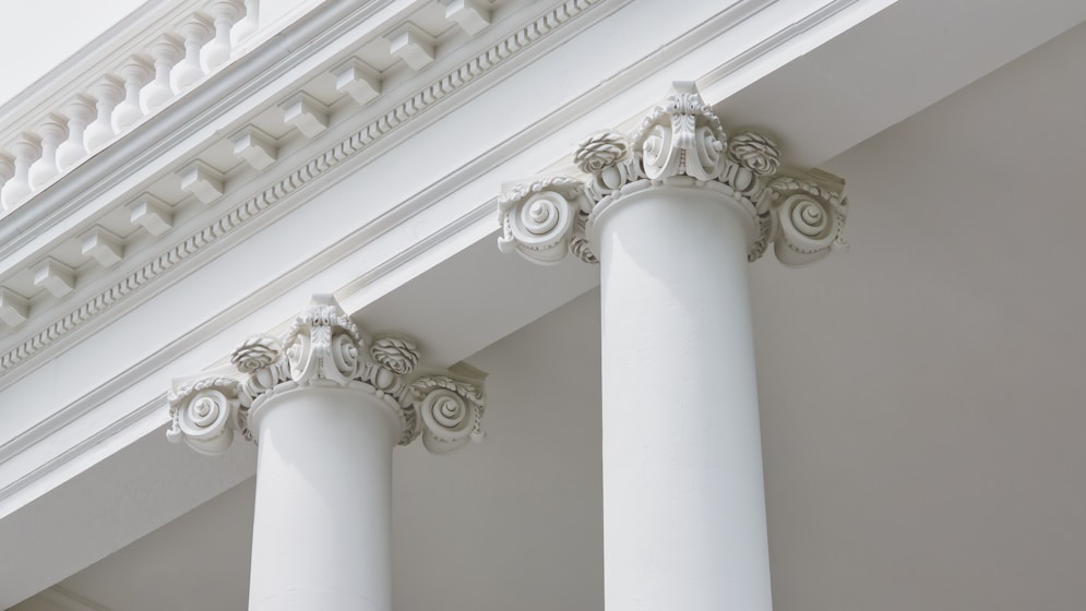 a white ceiling with a column