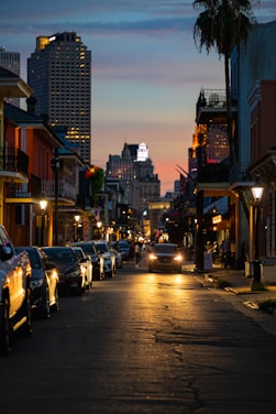 a street with cars on it and buildings on the side