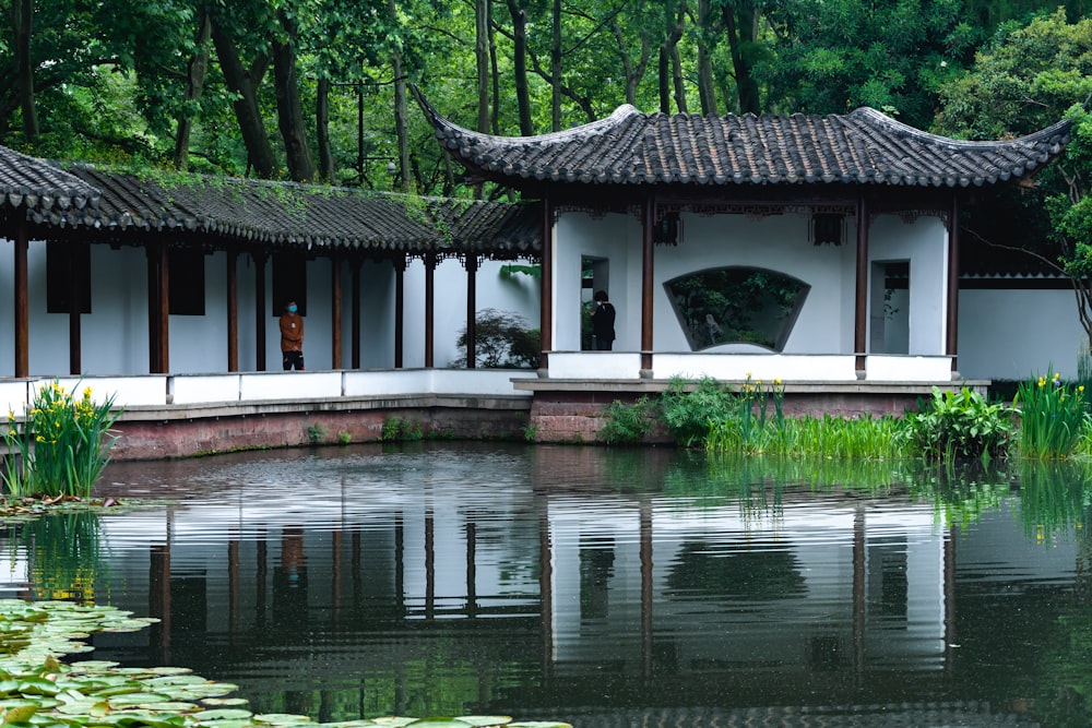 a house with a pond in front of it