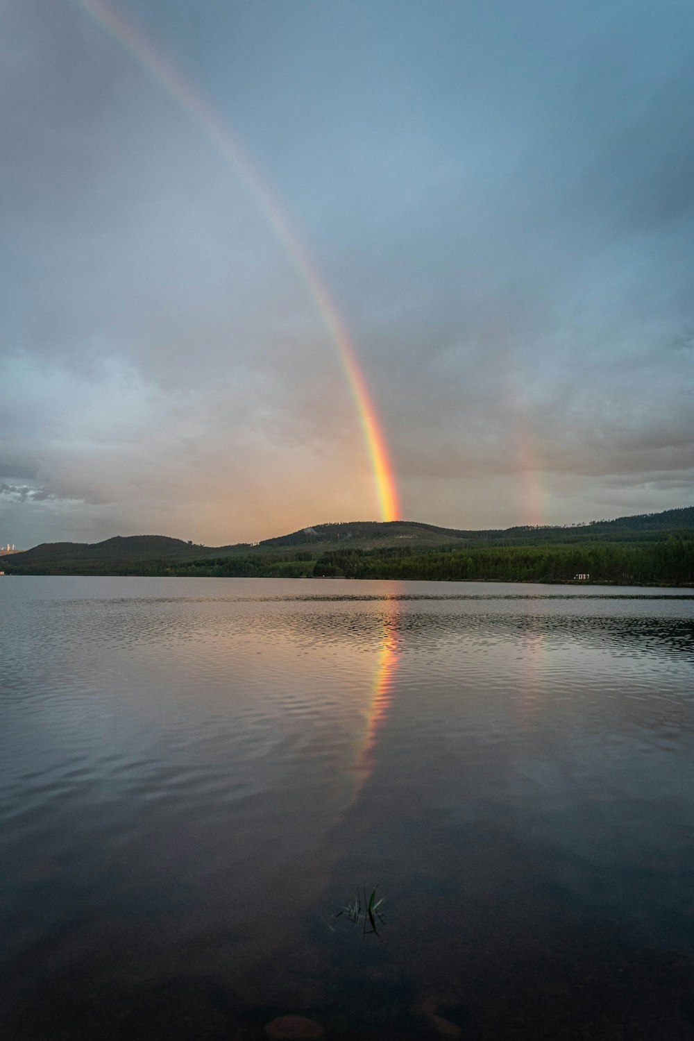 a rainbow over a lake