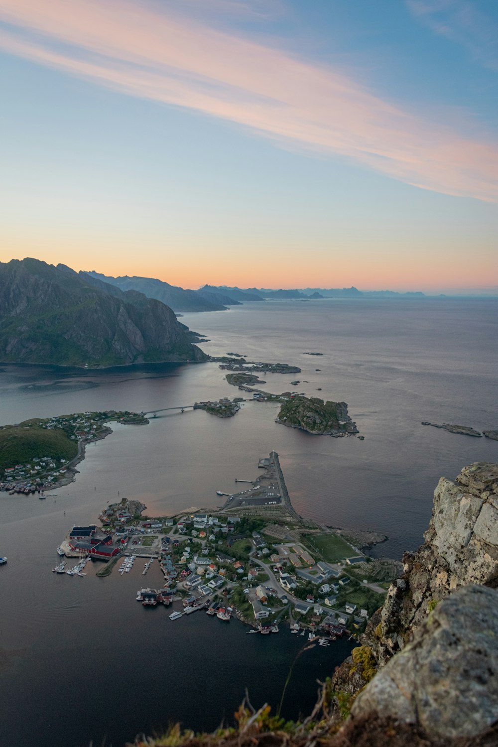 a body of water with boats and land around it