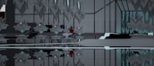 An abstract interior space with symmetrical geometric structures and mirrored surfaces. The design features sharp, angular elements with a modern aesthetic. A notable touch of red and blue hints at the presence of an abstract object or character nestled within the environment, creating a focal point amid the predominantly gray and black tones.