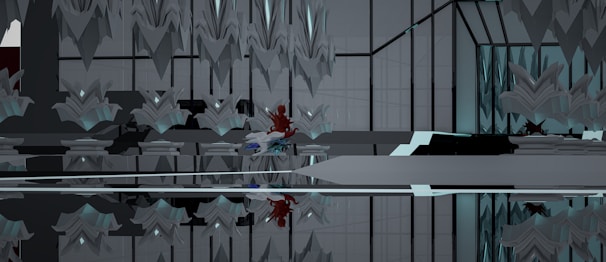 An abstract interior space with symmetrical geometric structures and mirrored surfaces. The design features sharp, angular elements with a modern aesthetic. A notable touch of red and blue hints at the presence of an abstract object or character nestled within the environment, creating a focal point amid the predominantly gray and black tones.