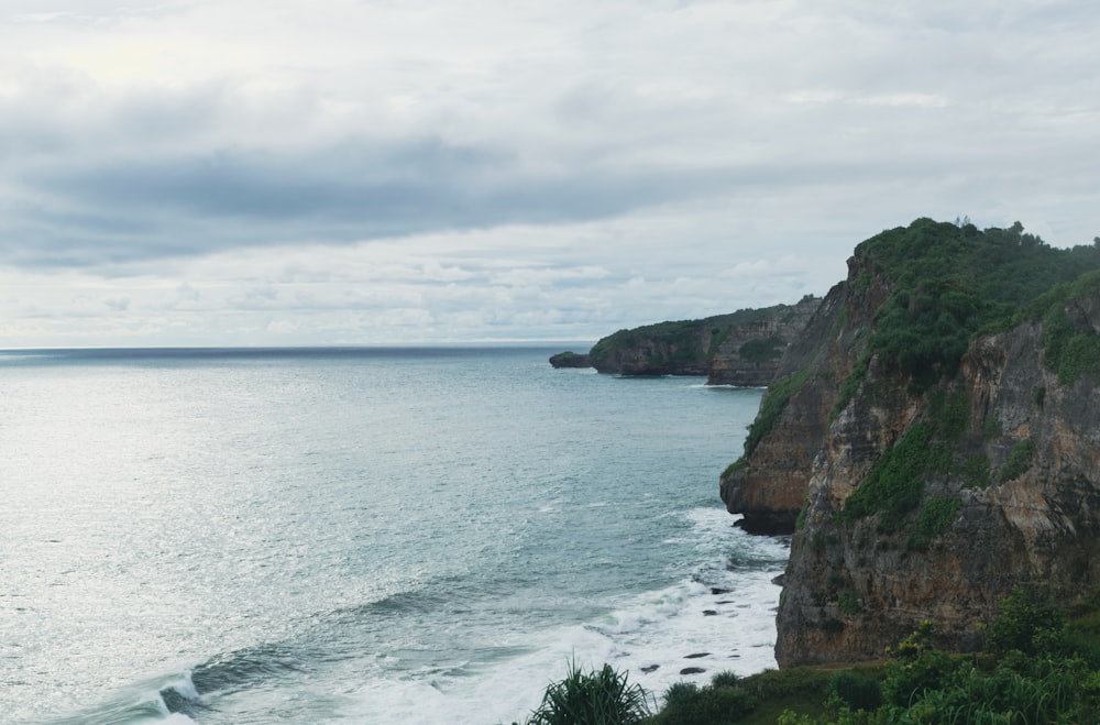 a cliff next to the ocean