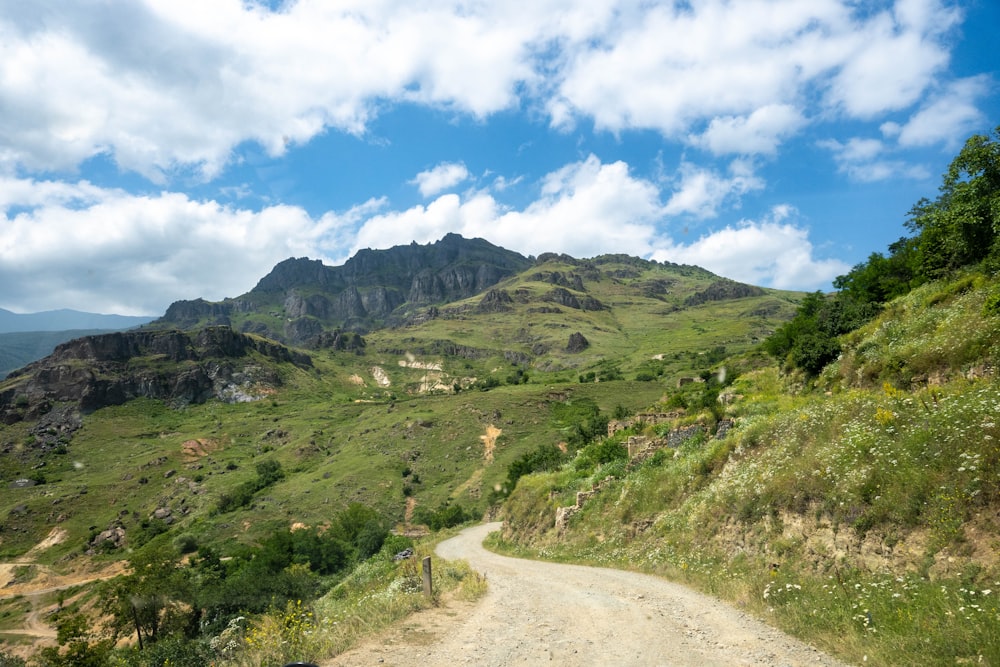 a dirt road in a valley