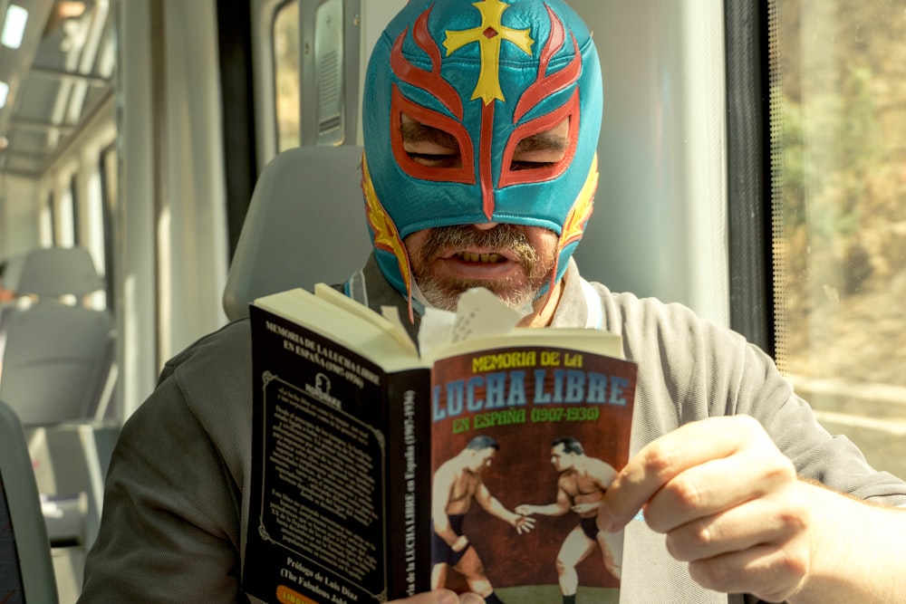 a person wearing a mask and holding a book