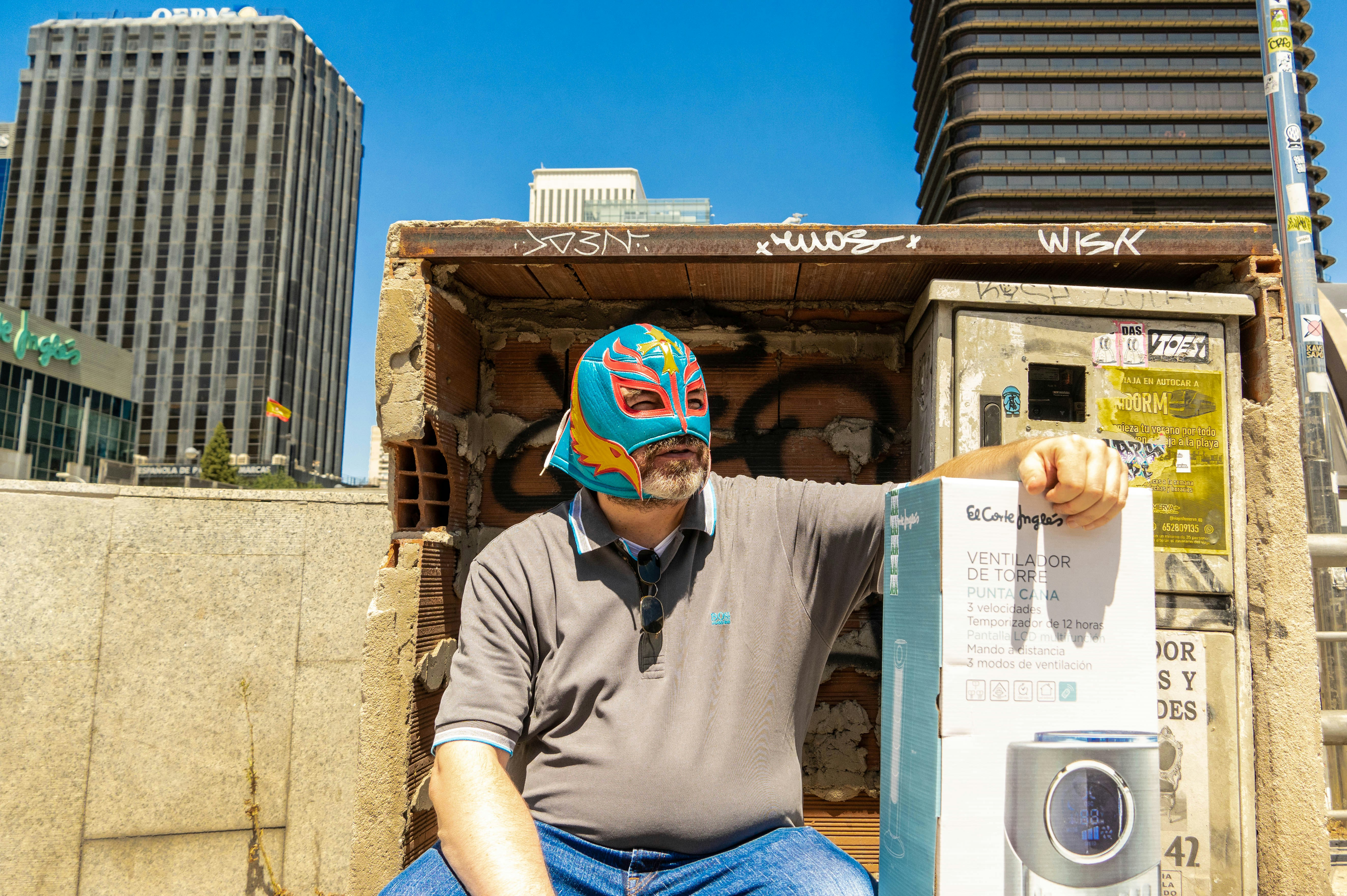 a person wearing a hat and holding a newspaper
