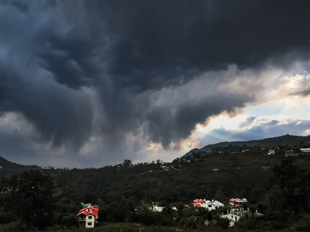 a dark cloudy sky over a small town