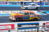 Mach1 car launching off the line during a high-adrenaline race event.
