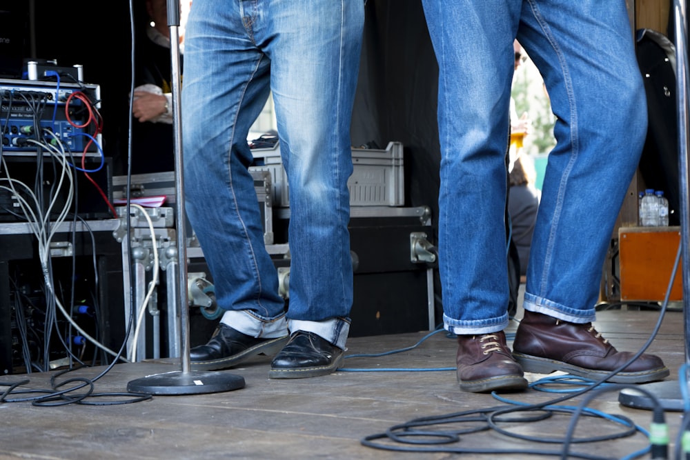 a pair of legs with jeans and shoes