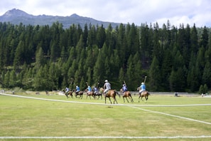 a group of people riding horses