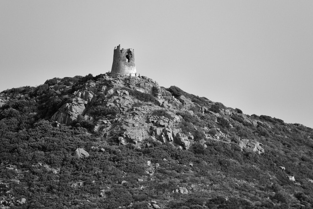 a stone tower on a hill