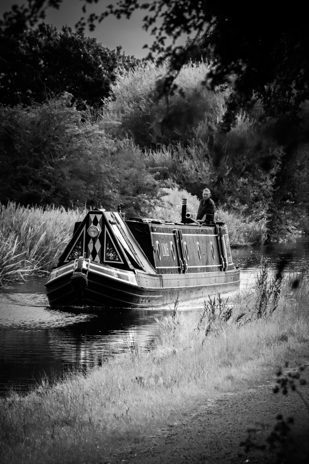 a person on a boat in a river