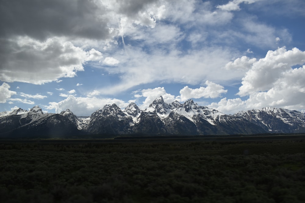 a landscape with mountains in the back