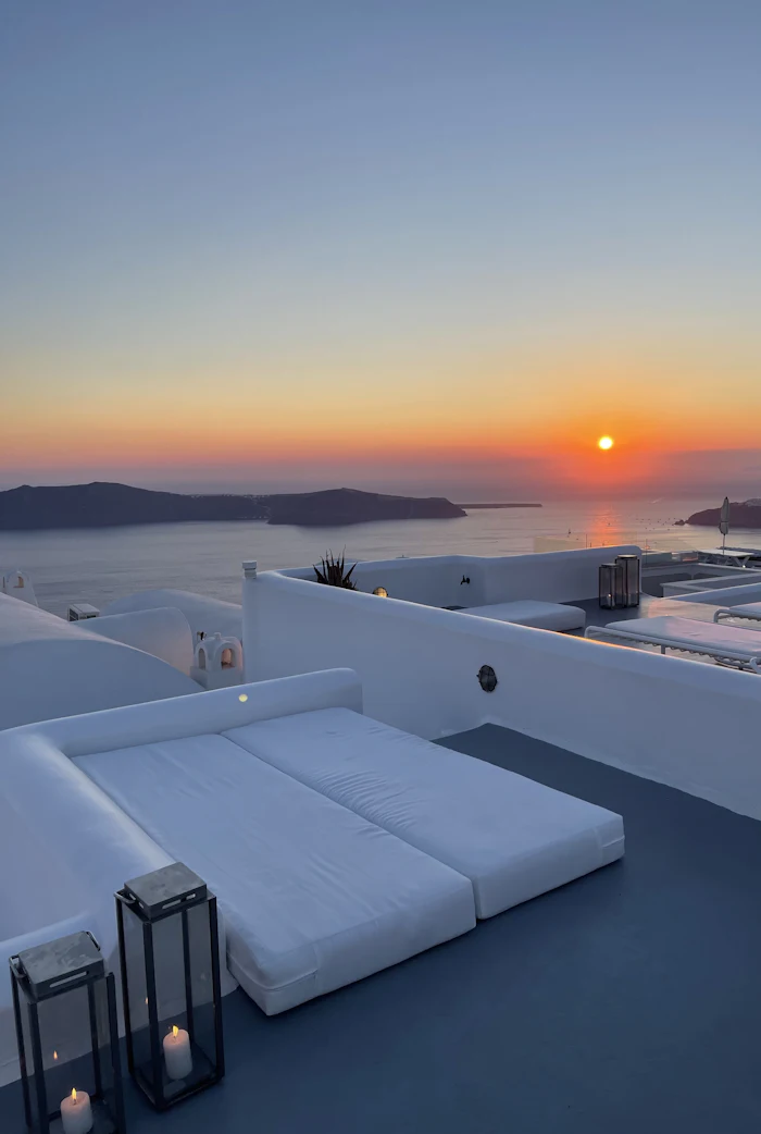 Golden sunset over the white rooftops of Oia in Santorini