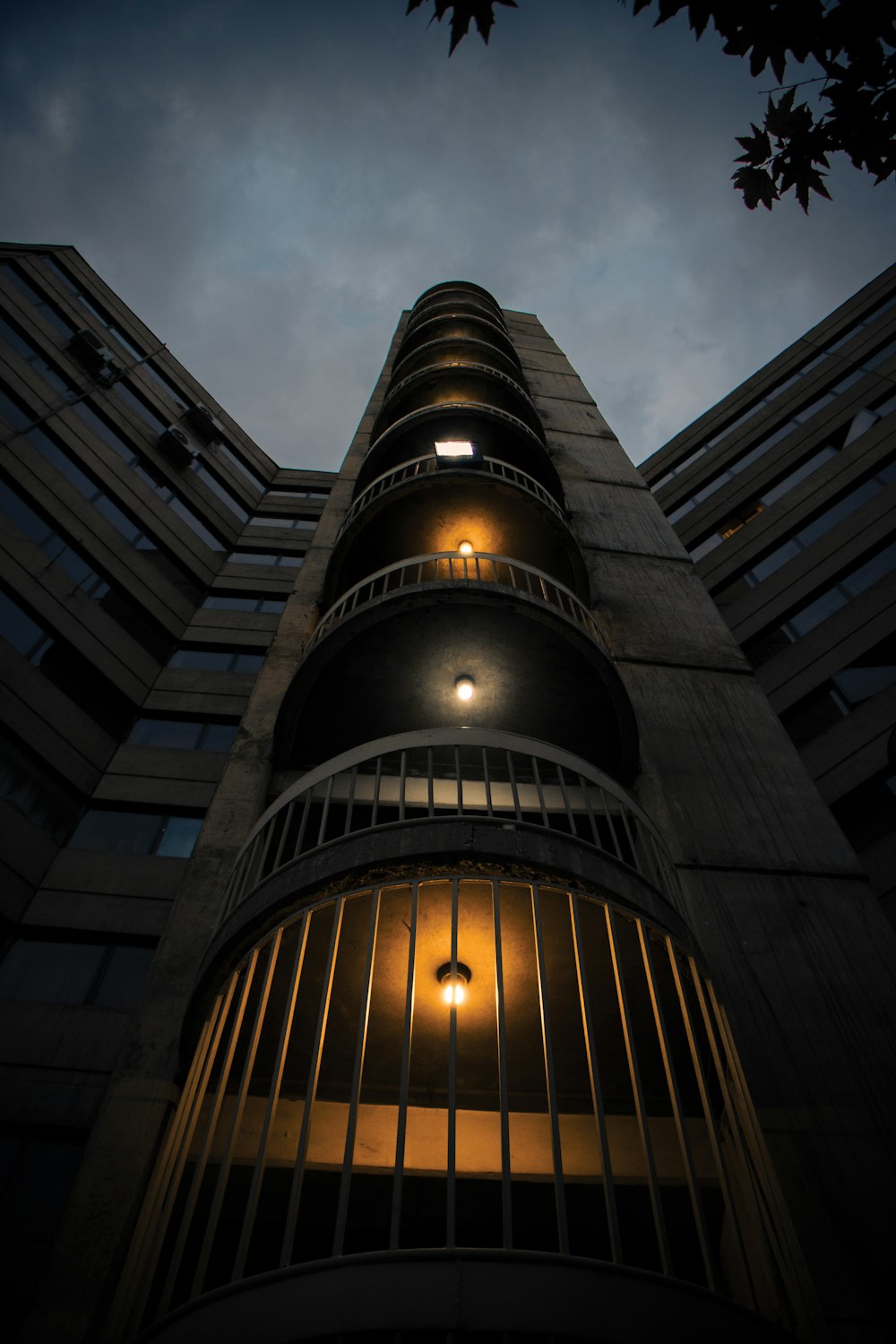 a tall building with a cloudy sky