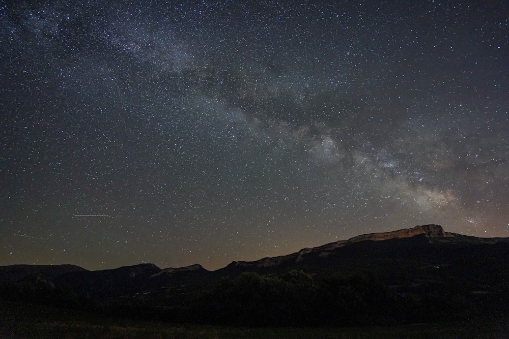 a mountain with a starry sky above it