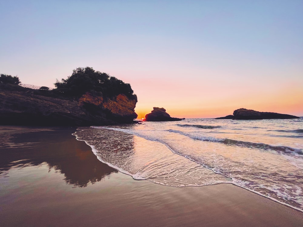 a beach with a sunset