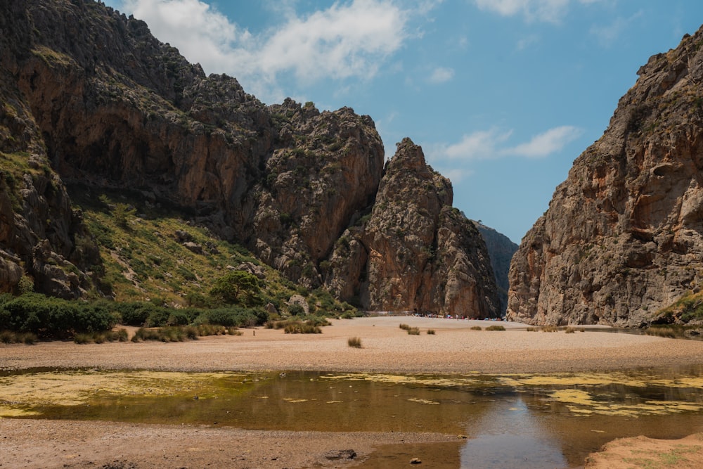 a beach with large rocks