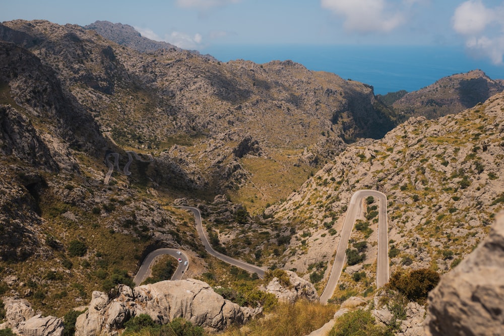 a bridge over a rocky canyon