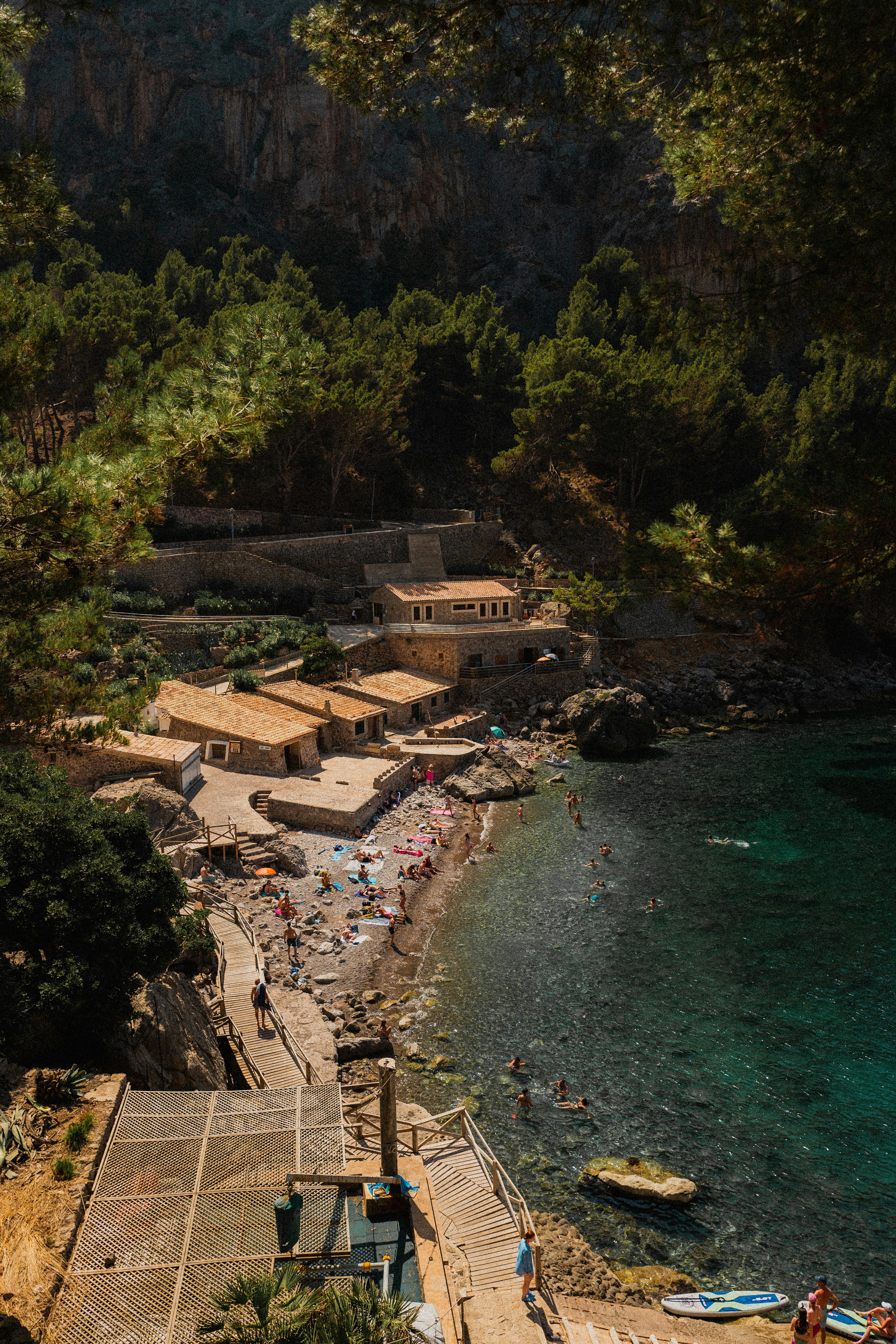 a beach with people and buildings