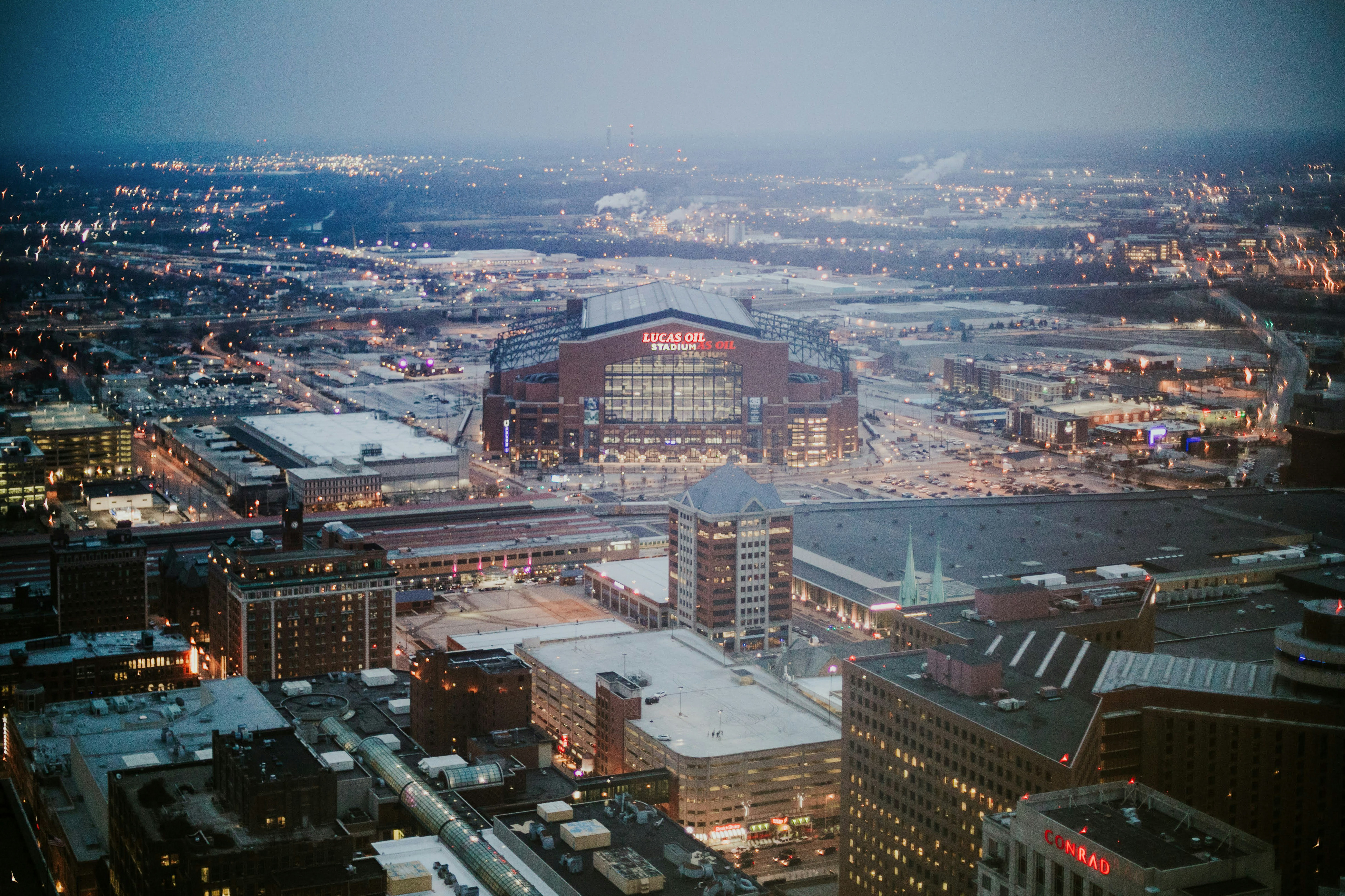 Lucas Oil Stadium viewed from the Salesforce Tower at dusk on a foggy day