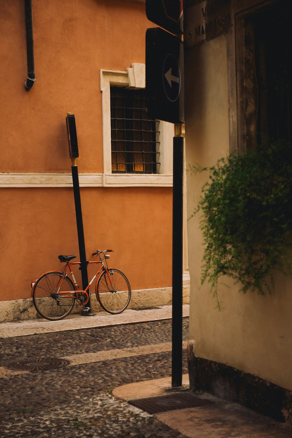 a bicycle parked on the side of a street