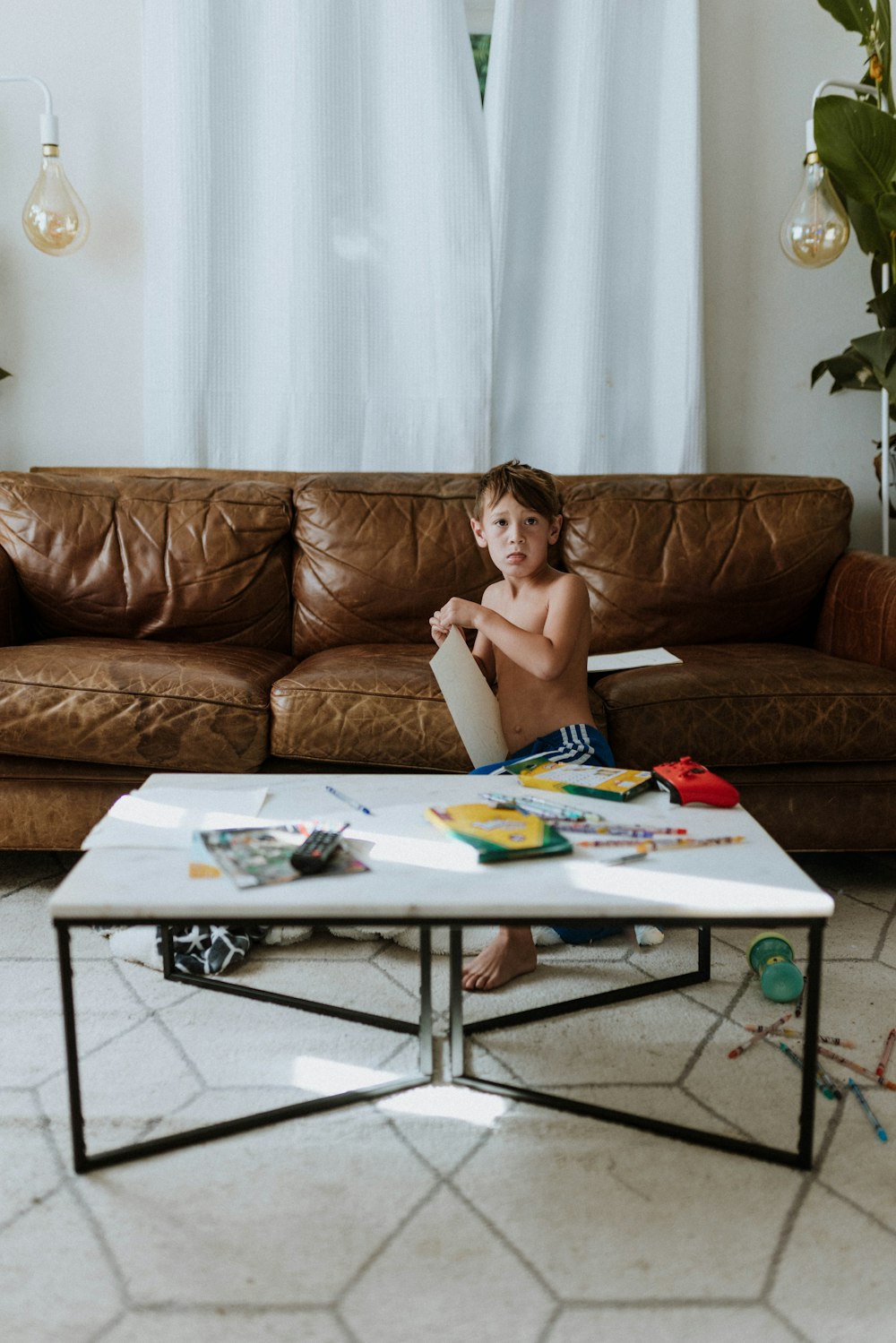 a child sitting on a couch