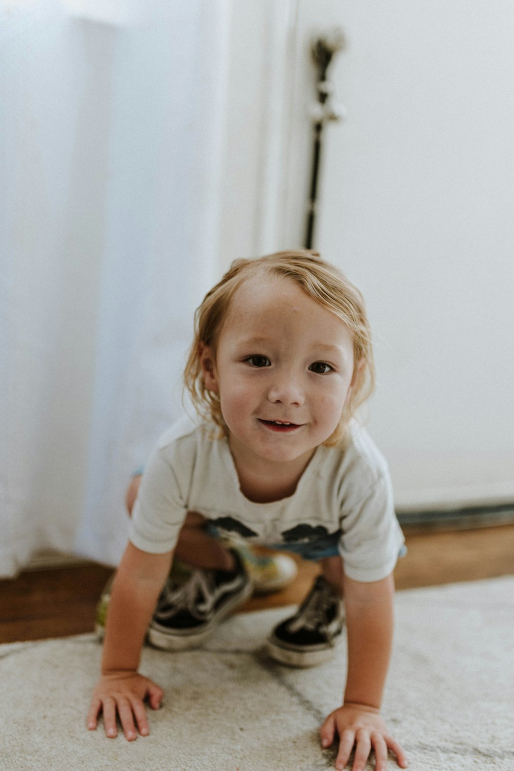 a baby crawling on the floor