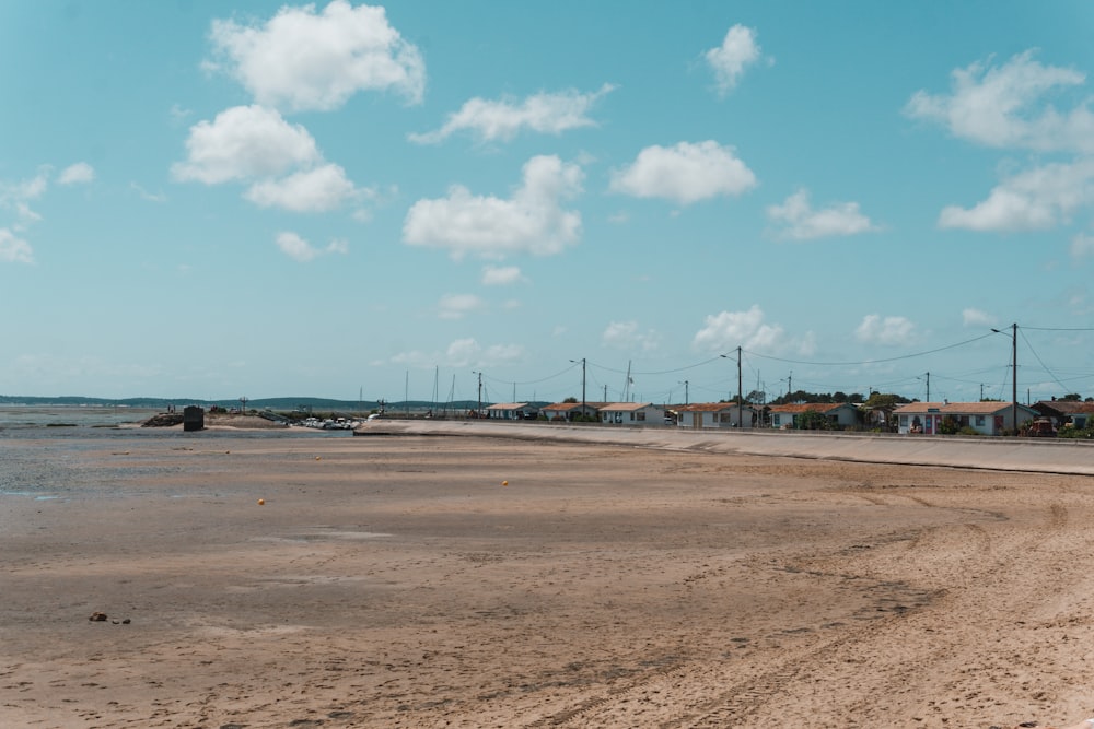 a dirt field with power lines