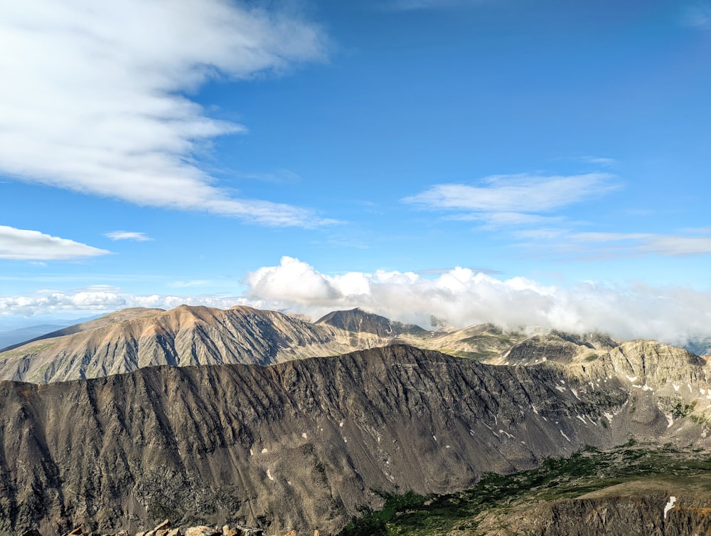 a mountain range with clouds