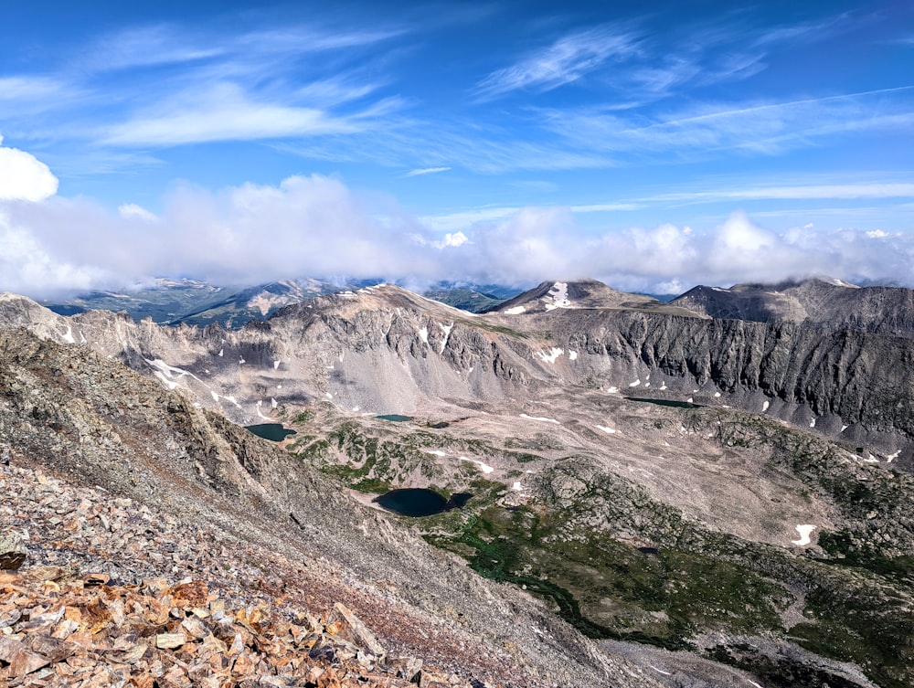 a valley with mountains in the background