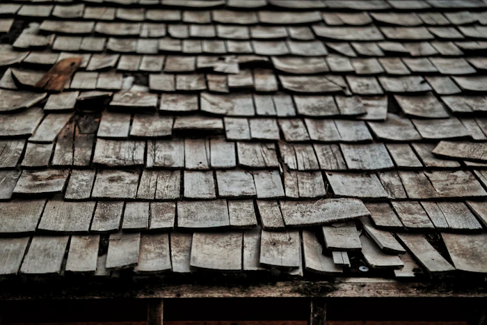 Worn and lifted roof shingles