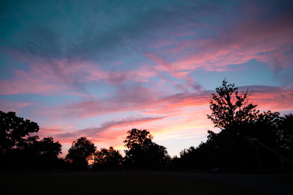 a sunset over trees