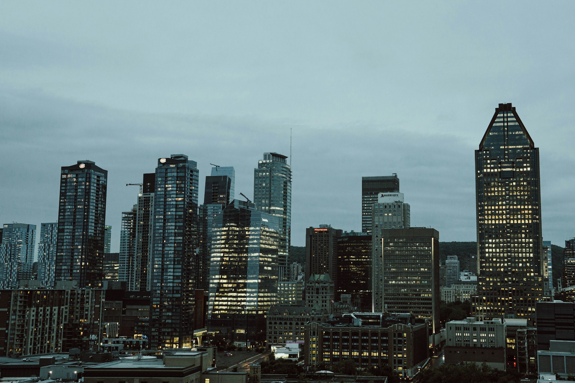 a city skyline with a cloudy sky
