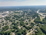 Aerial view of a prime land parcel ready for development surrounded by suburban homes.
