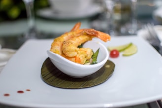 a bowl of shrimp on a plate