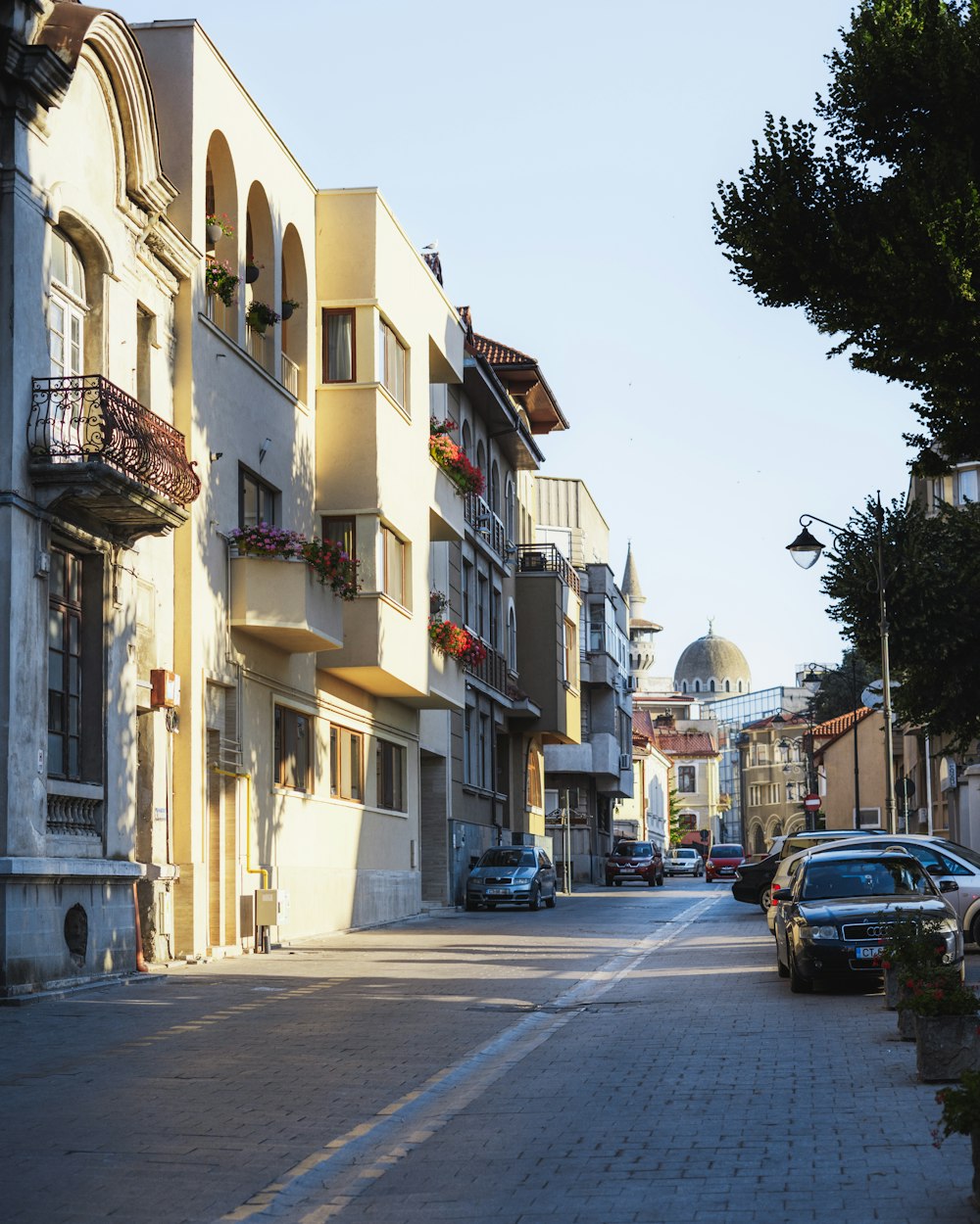 a street with cars parked on the side